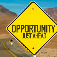 photo of a road sign that says opportunity just ahead
